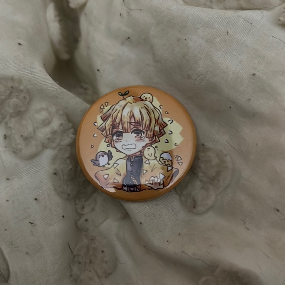 Pin with demon slayer guy on it. Brand new never been used.
